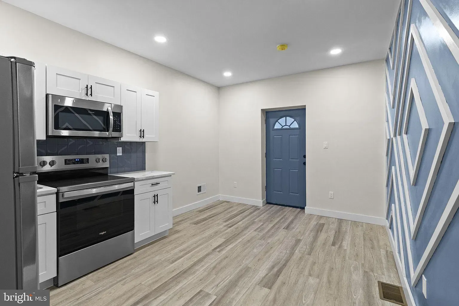 Kitchen and living area in Unit A at 6030 Sansom Street
