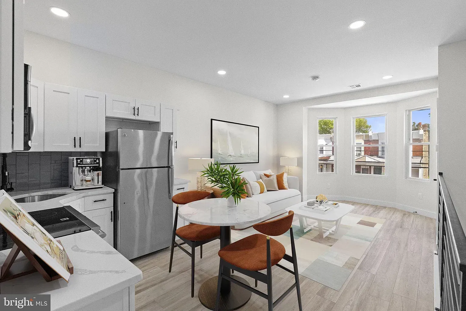 Bright Unit B bedroom with windows and light flooring