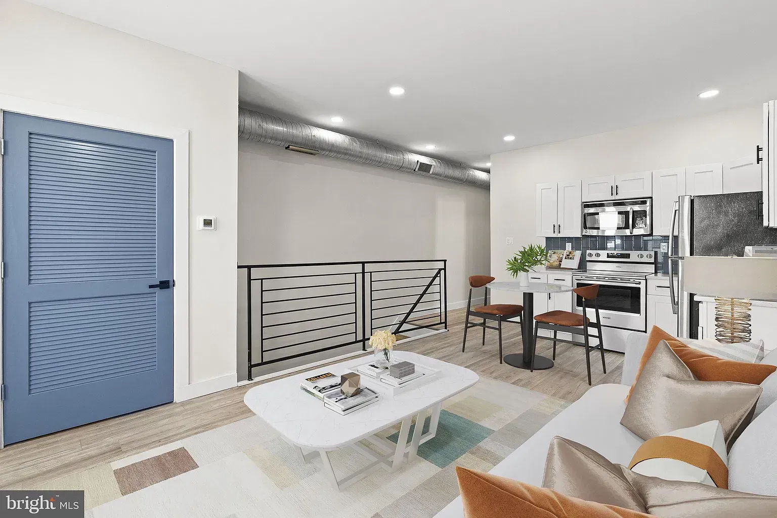 Unit B interior hallway with recessed lighting and wood-look flooring